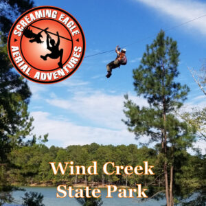 person on a zip line at Screaming Eagle Aerial Adventures at Wind Creek Square