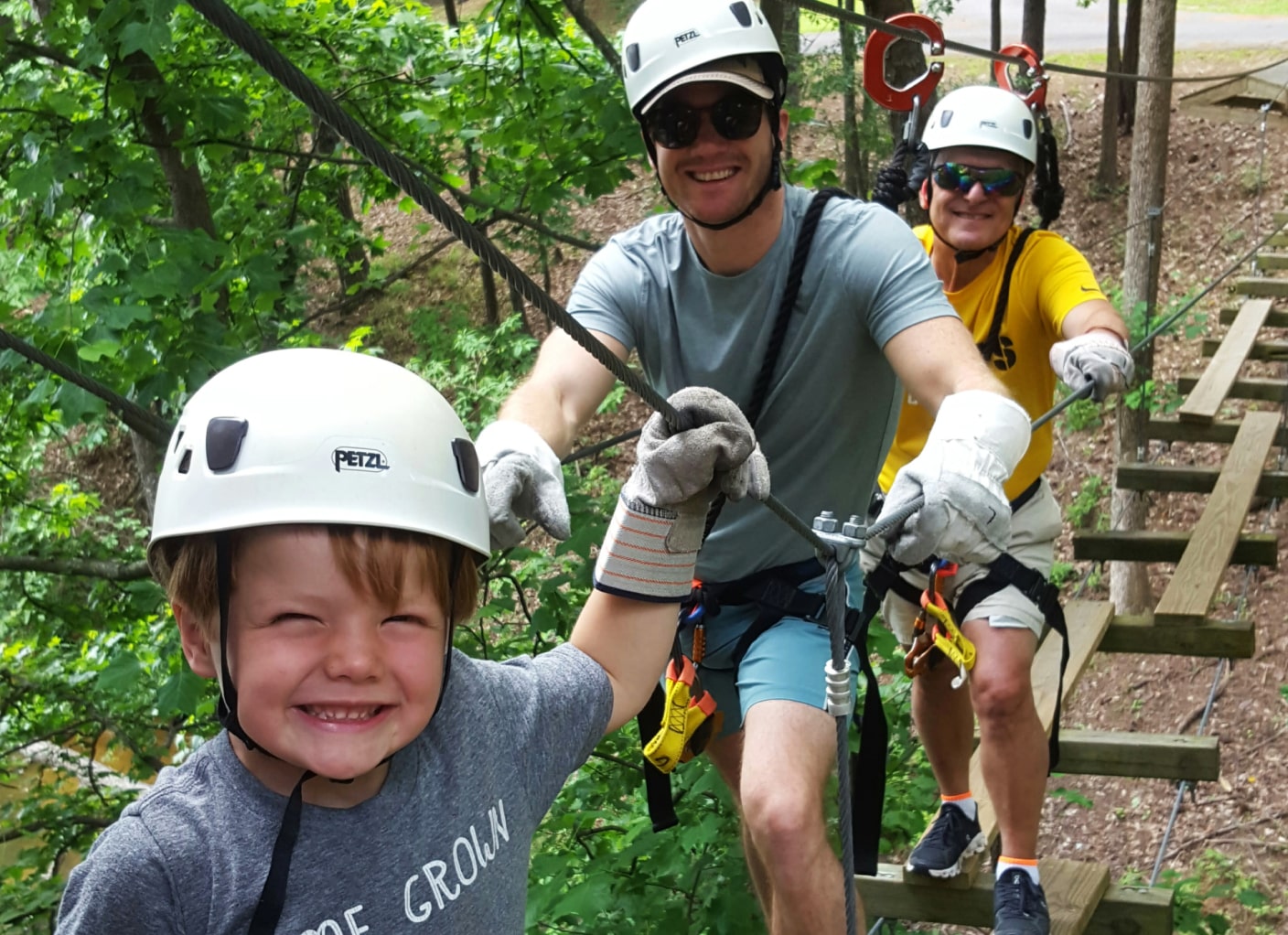 Three generations ziplining at aerial adventure park in alabama