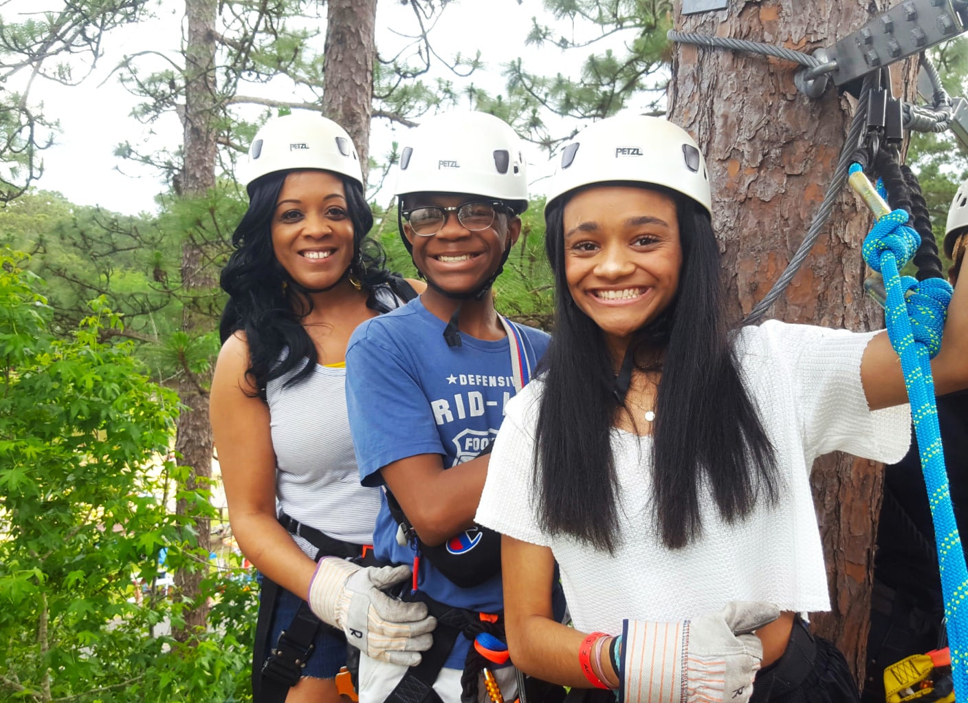 Family smiling at aerial adventure park in alabama