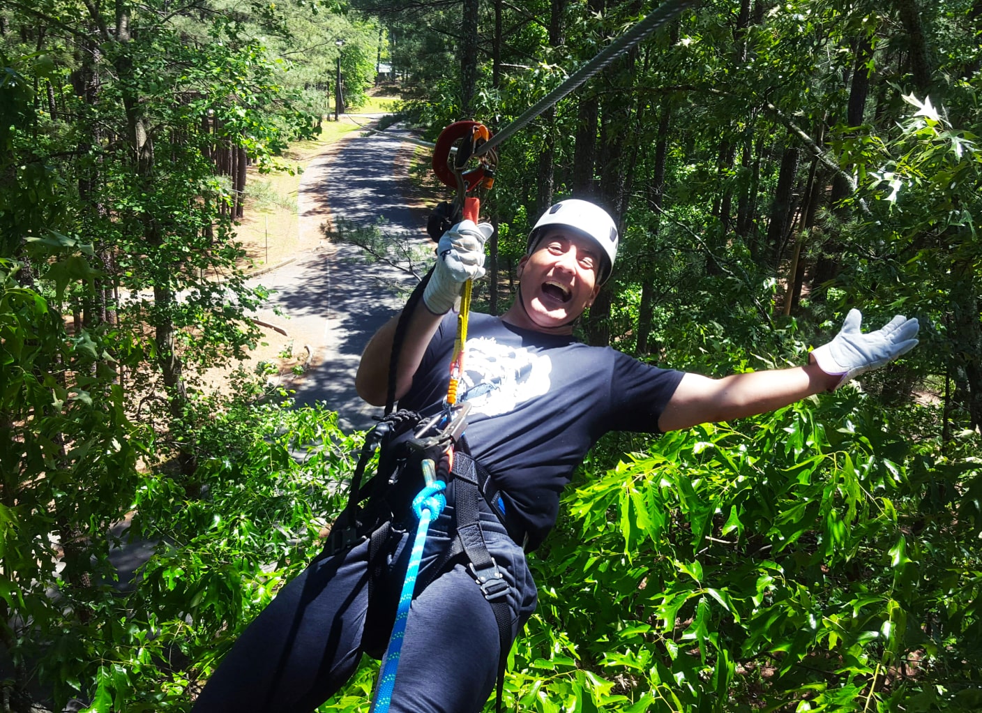 women ziplining in aerial adventure park